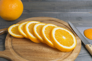 Sliced orange on cutting board.