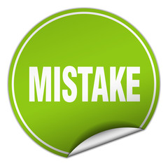 mistake round green sticker isolated on white