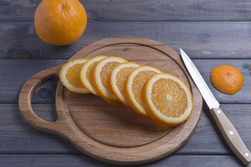 Sliced orange on cutting board.