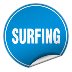 surfing round blue sticker isolated on white