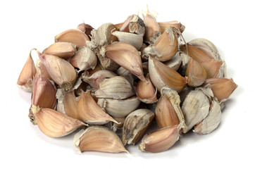 The cloves of garlic on white background
