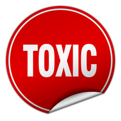 toxic round red sticker isolated on white