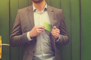 Young handsome man using smartphone.