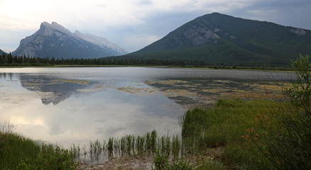 Mount Rundle and Sulphur Mountain reflecting in the the Vermilion lakes.  Located in Banff National Park, Alberta, Canada..