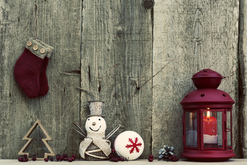 Christmas decorations on rustic wooden background