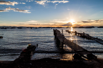 Sunset in a harbor  of Copacabana town on Titicaca lake, Bolivia