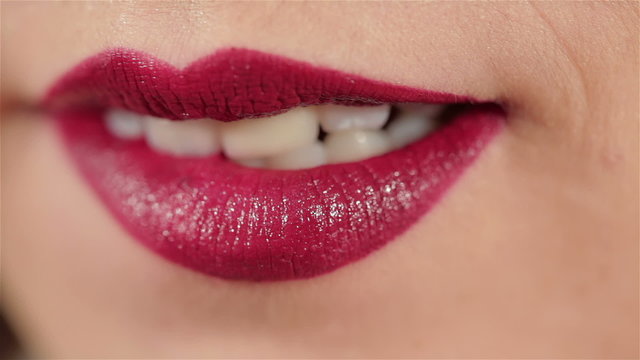 Make-up artist apply bloody lipstick