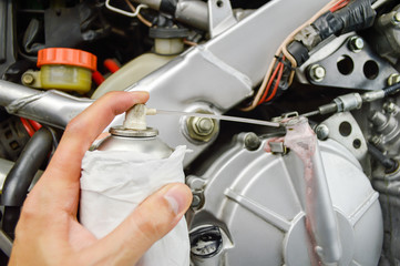 Obraz premium lubricating the motorbike