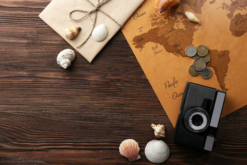 Beautiful composition with sea accessories and camera on table close up