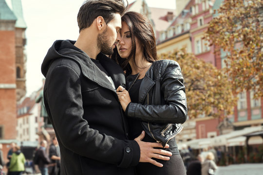 Sexy couple in jacket hugging each other