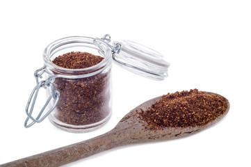 Red Chili pepper powder spices on spoon