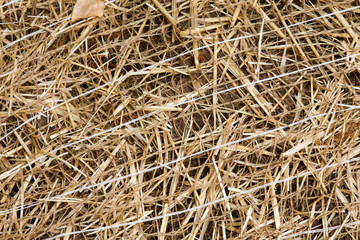 Full frame erosion control material made of straw and string