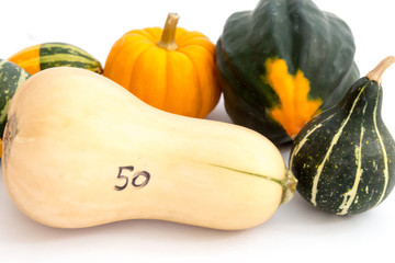 Gourds from a farmer's market with a 50 cent butternut squash