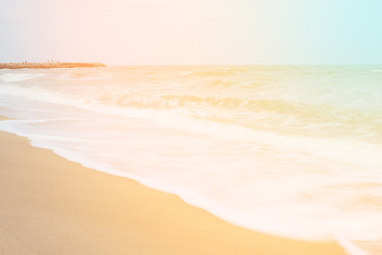 An abstract seascape with blurred motion. Image displays a retro, vintage look with cross-processed colors.
