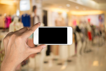 Using smartphone in a market or department store.