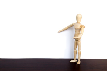 Wooden puppet businessman presents