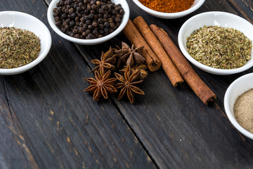 Spices and herbs in  bowls.