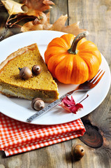 Obraz na płótnie Canvas Pumpkin pie, Thanksgiving tea setting, selective focus, toned image