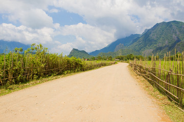 Fototapeta na wymiar Road near rice farming ,Vangvieng ,Laos