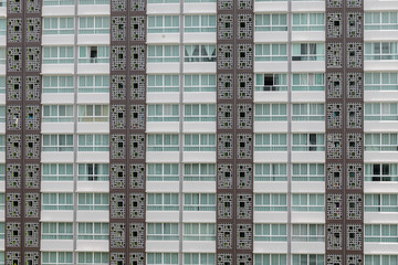Fototapeta na wymiar Pattern of windows in condominium room with attached small balco
