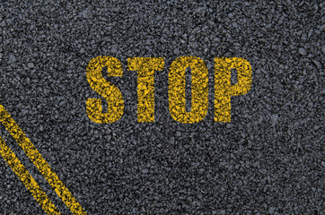 Stop sign background on asphalt with centre lines
