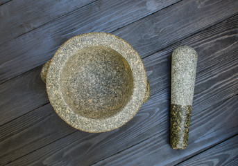 mortar on wooden background dark tone