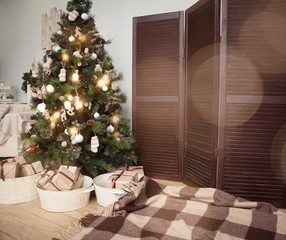 Christmas tree with presents underneath in living room