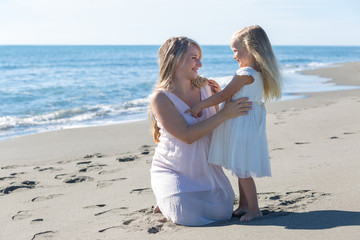 Portrait of a beautiful pregnant woman and daughter 