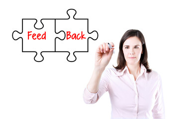 Businesswoman drawing a Feedback puzzle concept on the virtual screen.