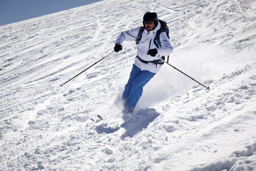 Man skiing on slope - winter holidays