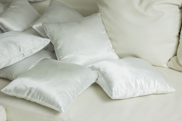 Fototapeta na wymiar White pillows on a bed Comfortable soft pillows on the bed