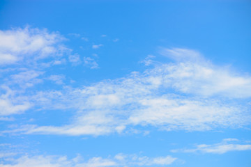 Blue sky with clouds background.
