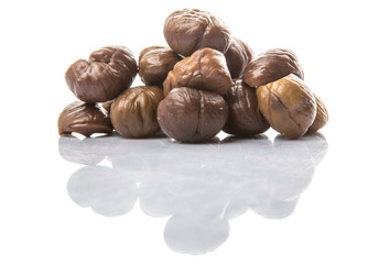 Roasted whole peeled chestnut over white background