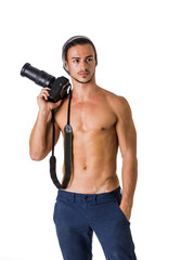 Fototapeta na wymiar Shirtless young man with professional photo camera