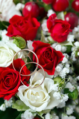 Golden wedding ring on the bride's bouquet. Bouquet 