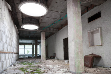 Fototapeta premium Abandoned industrial building interior, old room