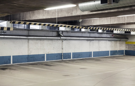 Empty urban parking interior, concrete walls