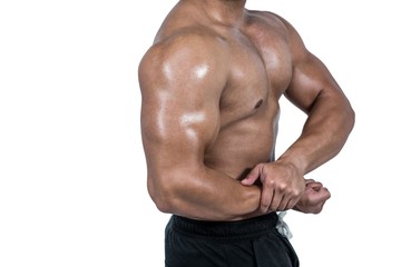 Fototapeta na wymiar Muscular man flexing his biceps