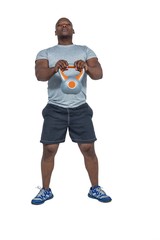 Fit man exercising with kettlebell 