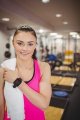 Fototapeta premium Fit woman smiling at camera