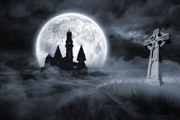 Castle and grave under full moon