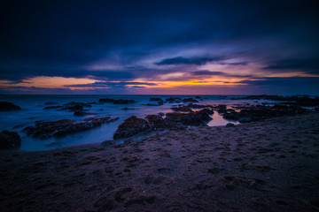 Fototapeta premium Colorful Sunset with Glowing Rocks Along the Pacific Coast Near Pigeon Point Lighthouse, California