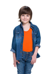 Smiling little boy in a jeans suit