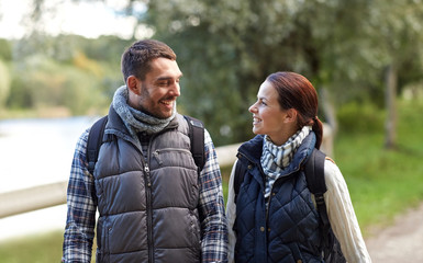 Fototapeta premium happy family walking with backpacks in woods