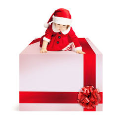 Christmas Gift Box and Baby in Santa Hat on White Background