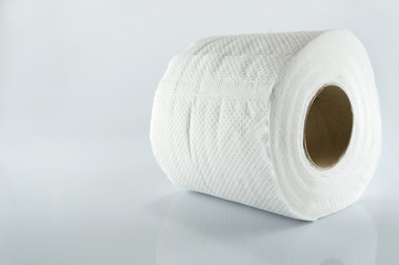 Toilet paper on gray background copy space