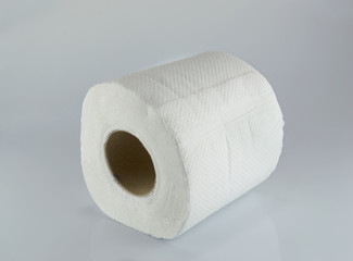 Toilet paper on gray background