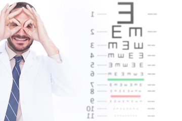 Composite image of doctor forming eyeglasses with his hands