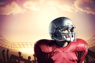 Composite image of american football player looking away