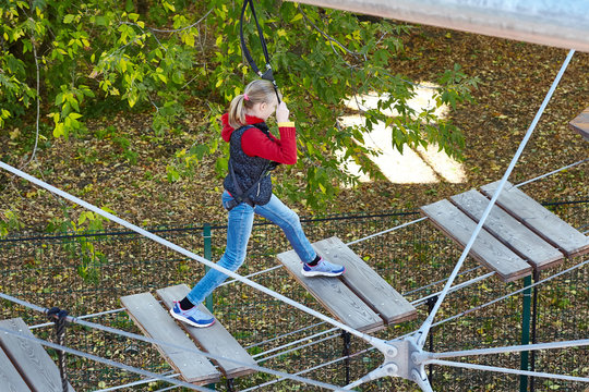 Girl athlete runs an obstacle course